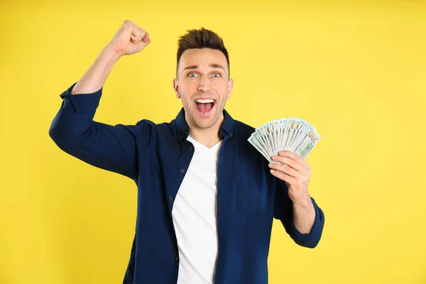 Emotional Man Cash Money Yellow Background — Stock Photo, Image