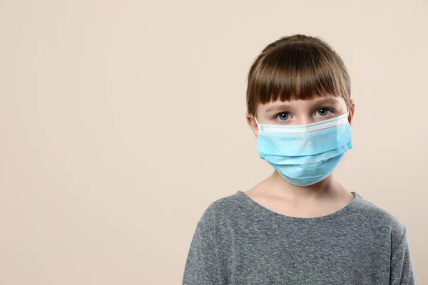 Little Girl Medical Mask Beige Background Space Text Virus Protection — Stock Photo, Image