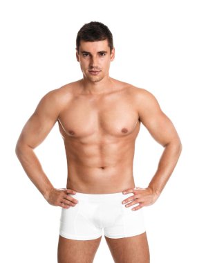 Beyaz arka planda seksi vücutlu bir adam.