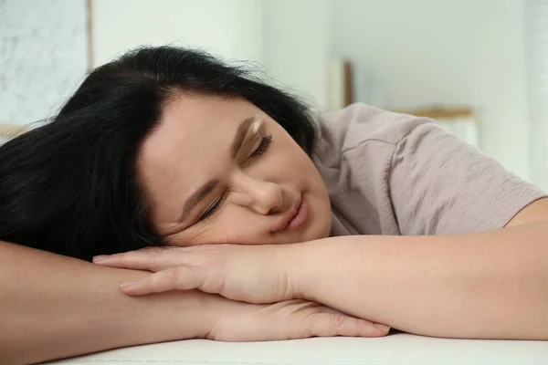 Lazy overweight woman sleeping at home, closeup