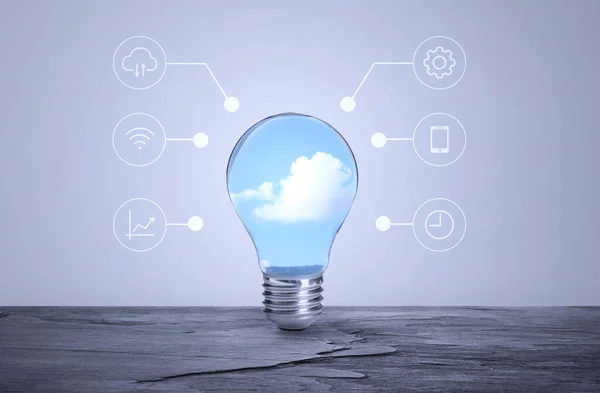 Cloud technology concept. Light bulb with sky and different icons