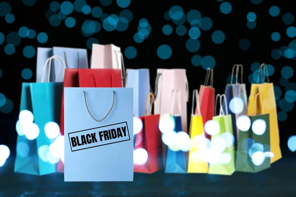 Black Friday Many Shopping Bags Blurred Lights — Stock Photo, Image