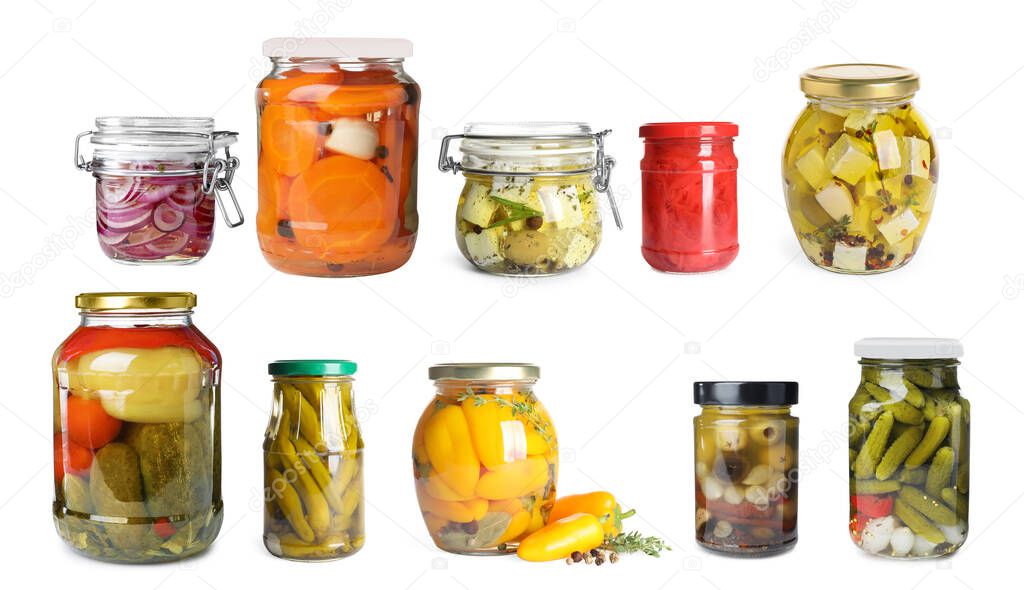 Set of jars with pickled vegetables and feta cheese on white background