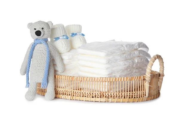 Wicker Tray Disposable Diapers Toy Bear Child Booties White Background — Stock Photo, Image