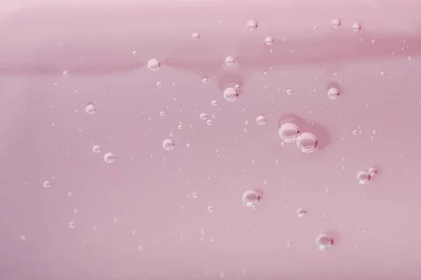 ピンクの背景に純粋な透明化粧ジェル クローズアップ — ストック写真