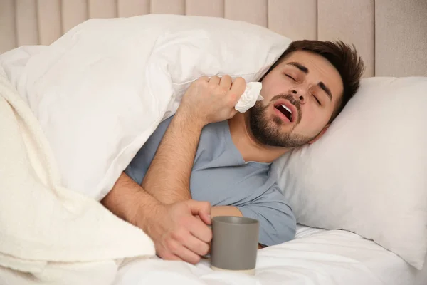 Sick Young Man Cup Hot Drink Bed Home Influenza Virus — Stock Photo, Image