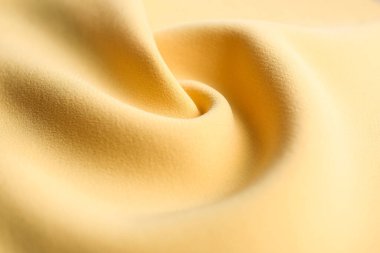Arka plan olarak güzel sarı kumaşın dokusu, yakın plan