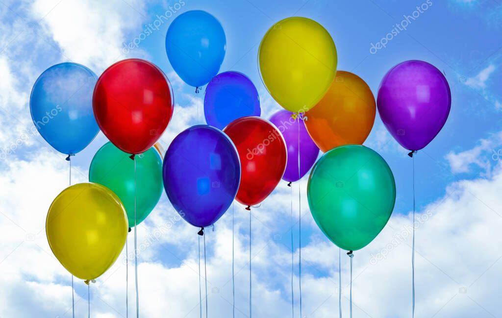Many colorful balloons outdoors on sunny day