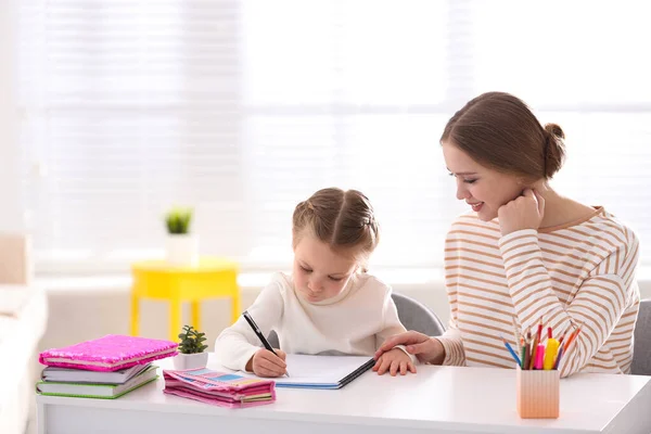 Woman Helping Her Daughter Homework Table Indoors — Stock Photo, Image