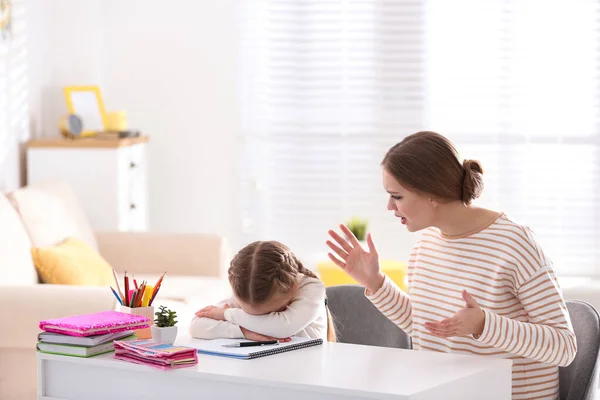 Mother Scolding Her Daughter While Helping Homework Indoors — Stock Photo, Image