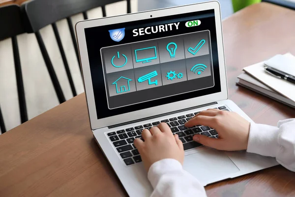 Woman Using Home Security App Indoors Closeup — Stock Photo, Image