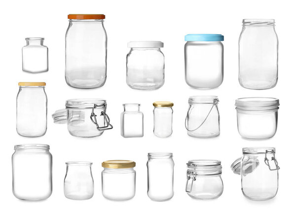 Set with different empty glass jars on white background