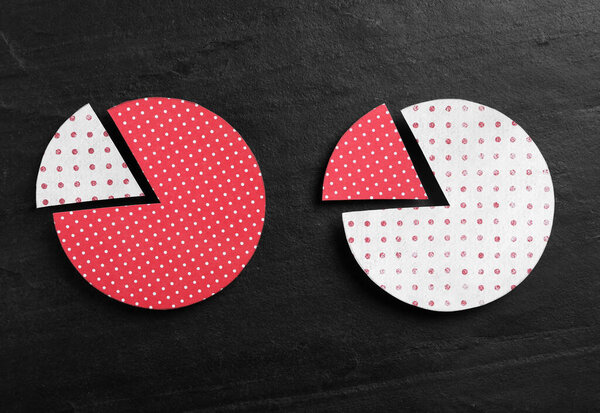 Бумажные круги с обменными сегментами на черном фоне, плоский лежал. Принцип Парето