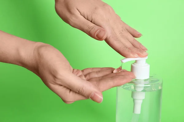 Woman Applying Antiseptic Gel Hand Green Background Closeup — Stock Photo, Image