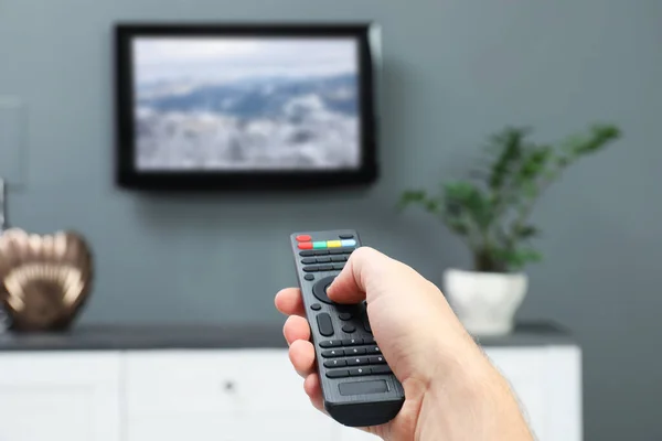 Man Switching Channels Remote Control Home — Stock Photo, Image