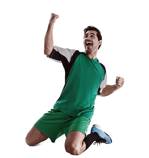 Young emotional football player on white background