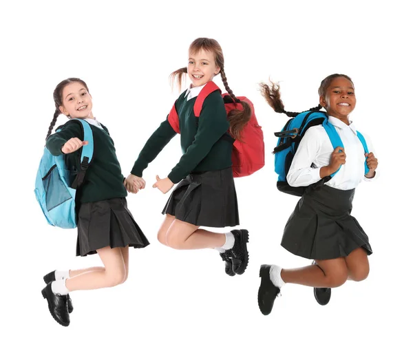 Niños Uniforme Escolar Saltando Sobre Fondo Blanco — Foto de Stock