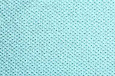 Arkaplan olarak desenli açık mavi kumaş, yakın plan