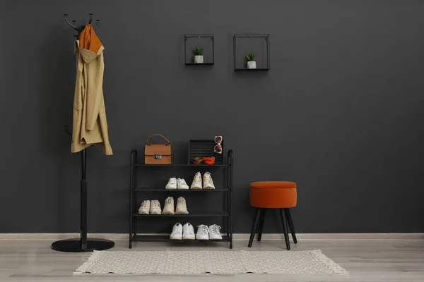 Hallway interior with stylish furniture, clothes and accessories