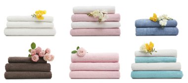 Beyaz arkaplanda katlanmış yumuşak havlu seti