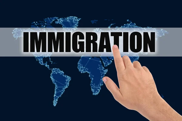 Man Pointing Word Immigration World Map Dark Blue Background Closeup — Stock Photo, Image