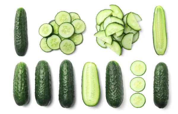 stock image Set with sliced cucumbers on white background, top view