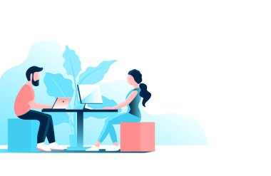 Young man and woman work in the office at the computer.