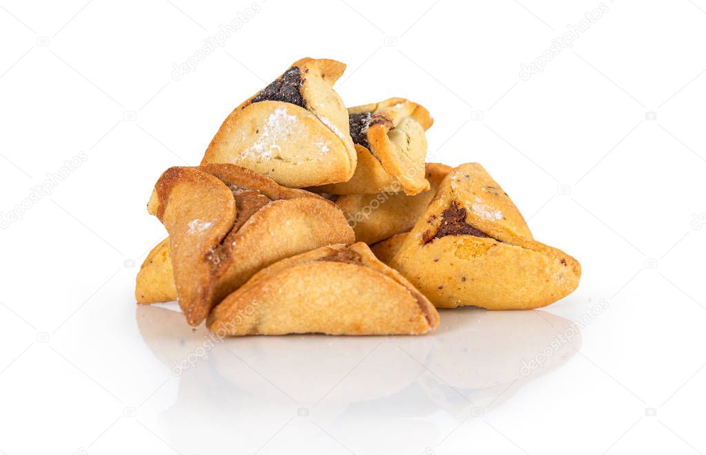 Haman's ears are also called Hamantaschen - a traditional Jewish pastry for Purim holiday. Organized in interesting shapes and isolated on a white background.