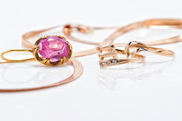 Gold earrings and rings from different sets — Stock Photo, Image