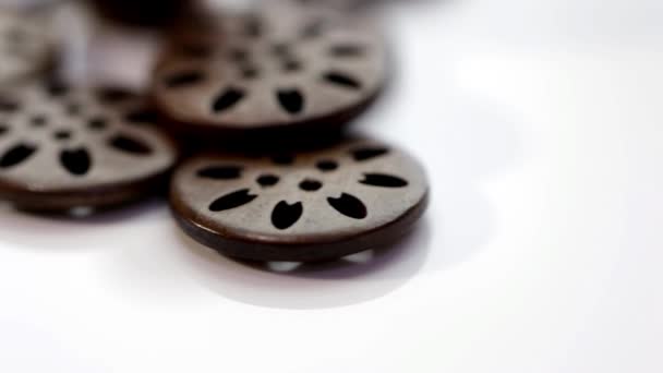 Buttons of various shapes, sizes and colors on a rotating stand — Stock Video