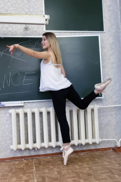 Charming young girl student with Pointe shoes — Stock Photo, Image