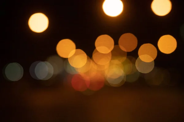 Gece şehir ışıklarının soyut görüntüsü. — Stok fotoğraf