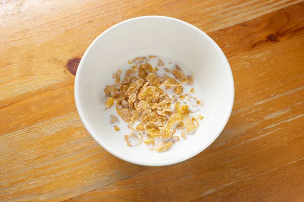 Schüssel Cornflakes Milch Auf Holz Hintergrund Von Oben — Stockfoto