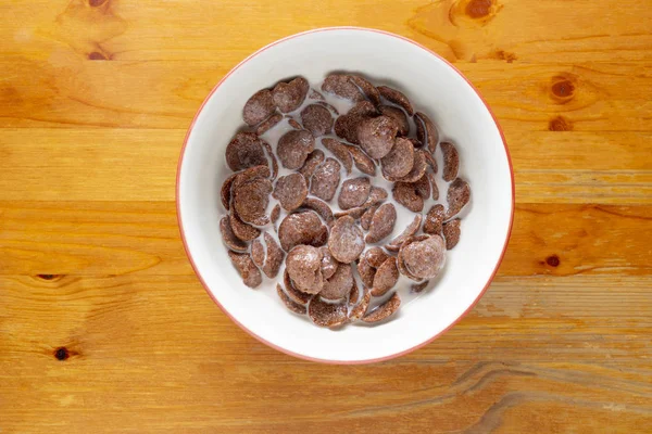 Chocolade Ontbijtgranen Een Kom Een Houten Vloer Van Boven — Stockfoto