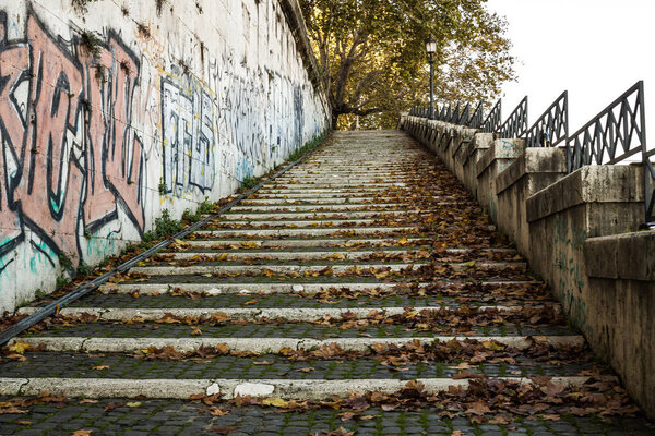 Rome, Sunny day, stairs leading to the banks of the Tiber river