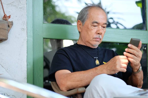 Senior man relaxing at home — Stock Photo, Image