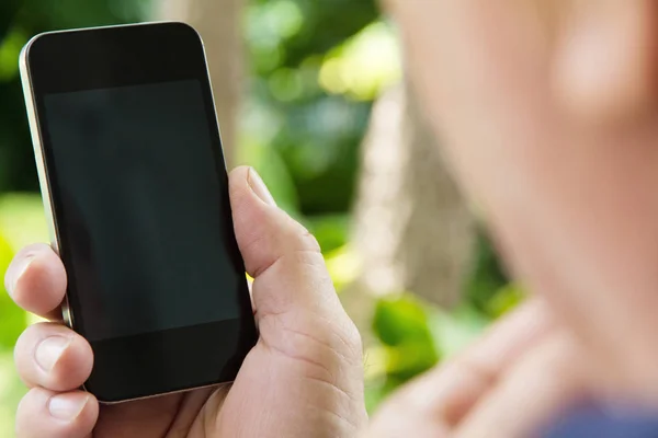 Hand holding a smart phone — Stock Photo, Image