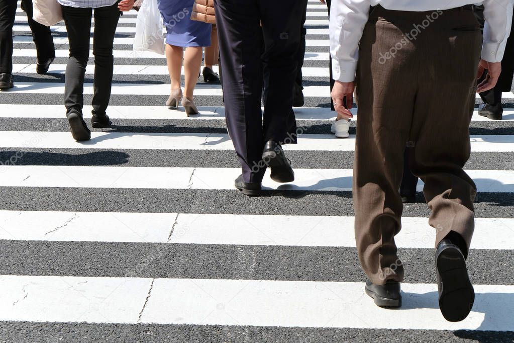 Pedestrians cross at Shibuya Crossing