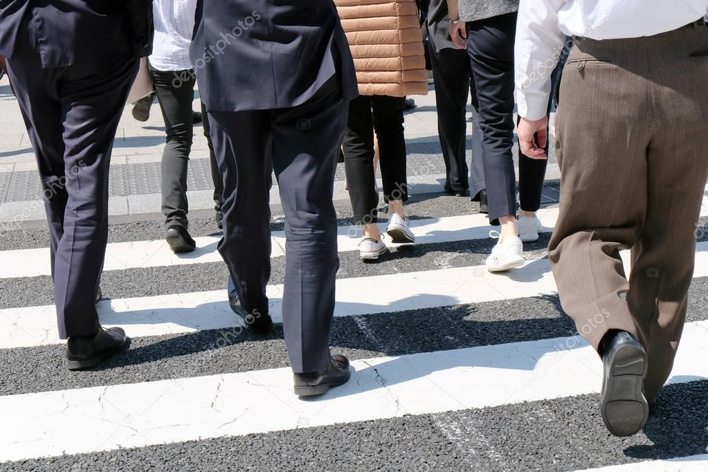 Pedestrians cross at Shibuya Crossing