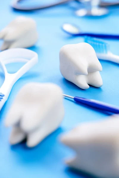 Dental model and dental equipment on blue background, concept image of dental background. dental hygiene background