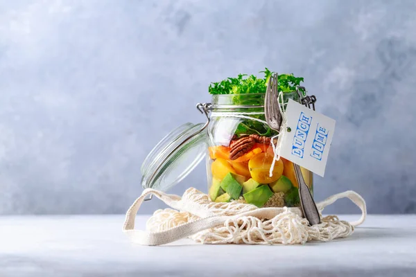 Homemade salad in glass jar with quinoa and vegetables with label lunch time no plastic and take away concept — Stock Photo, Image