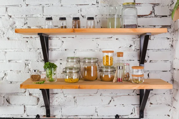 Interior of modern kitchen white brick wall zero waste concept glass jars mesh reuse bag — Stock Photo, Image