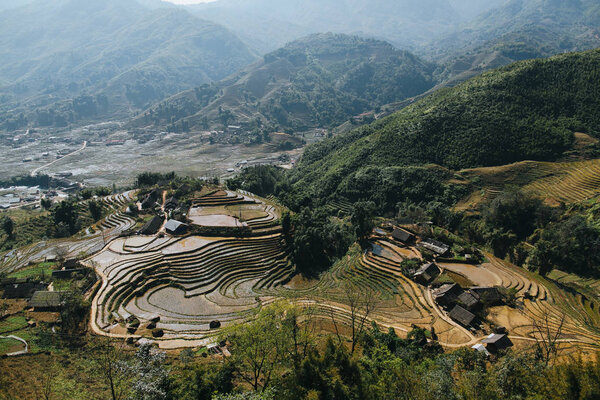 agricultural terraces and buildings in beautiful mountains, Sa Pa, Vietnam