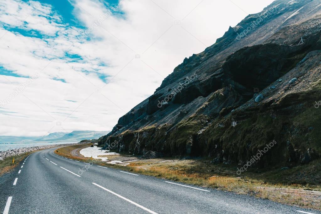 Empty asphalt road and beautiful landscape in western iceland