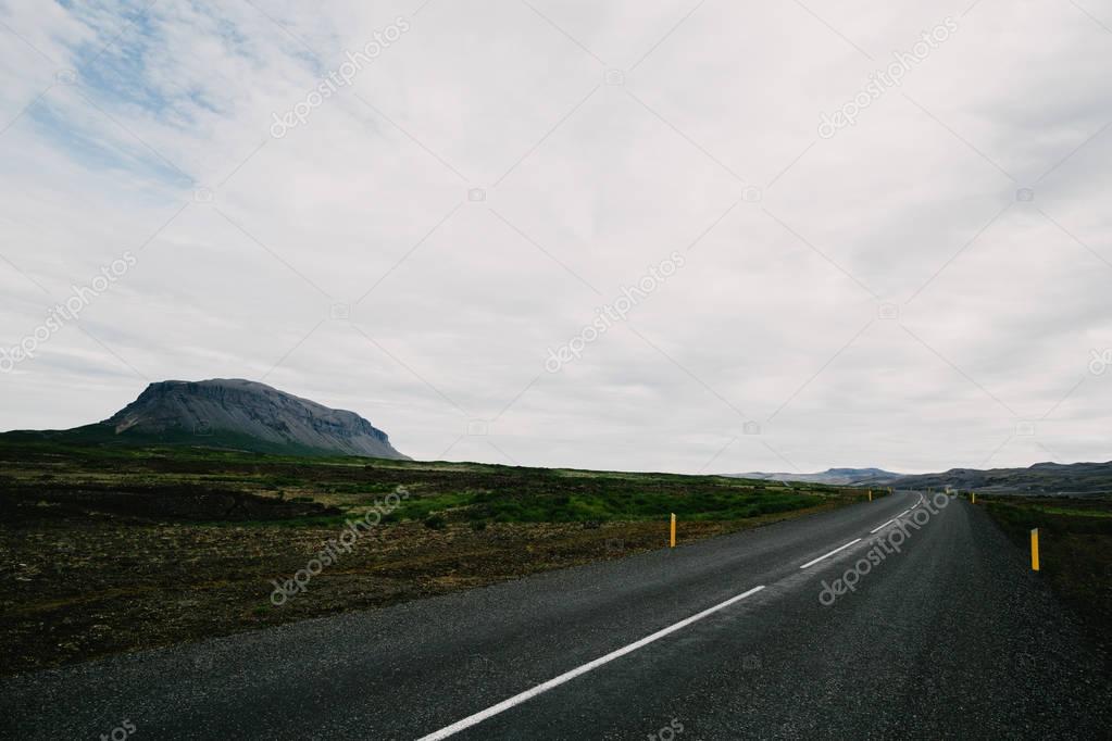 Empty asphalt road and beautiful icelandic landscape