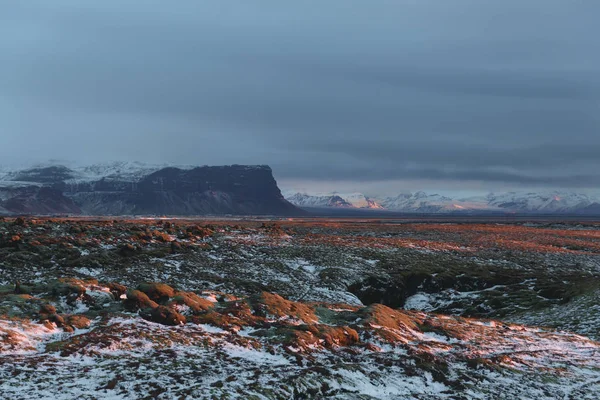 scenic landscape with rocky mountains and valley with snow, iceland