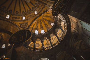 ISTANBUL, TURKEY - OCTOBER 09, 2015: low angle view of interior of illuminated suleymaniye mosque clipart