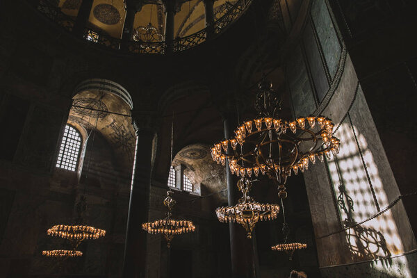 ISTANBUL, TURKEY - OCTOBER 09, 2015: low angle view of chandeliers in suleymaniye mosque