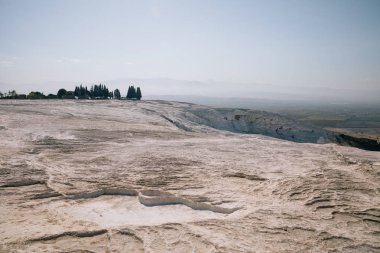spectacular view of beautiful white limestone in pamukkale, turkey clipart