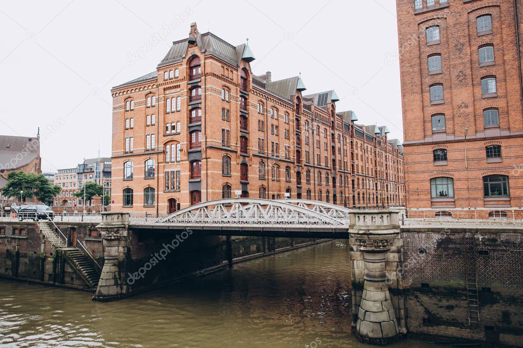 urban scene with warehouse district and city river in hamburg, germany